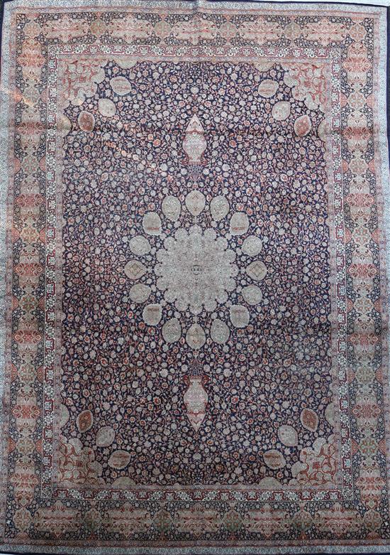 A Kashmir blue ground silk on cotton carpet, 13ft 8in by 8ft 10in.